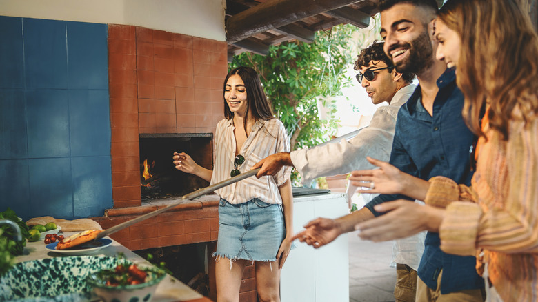 People preparing food outside