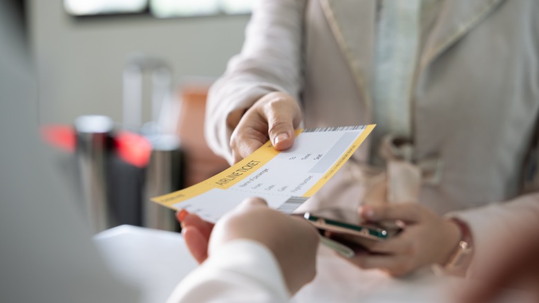 Person receiving boarding pass