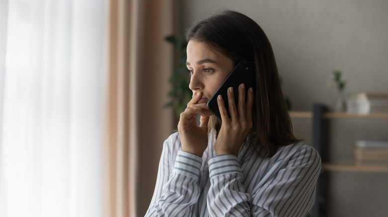 Person on phone in hotel