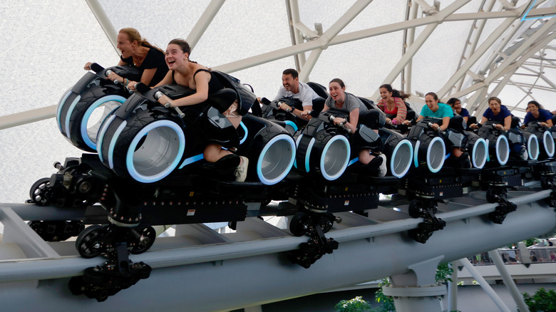 People riding Tron at Disney World