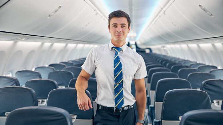 Flight attendant ready for passengers