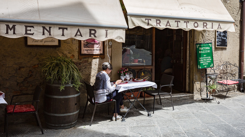 woman at Italian sidewalk cafe