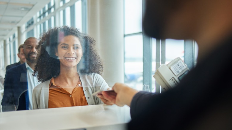 Woman with passport at customs