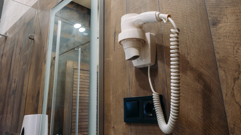 Hotel hair dryer on wall