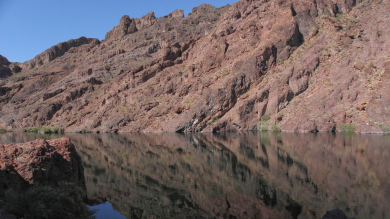 Rock formations reflected in the Colorado River