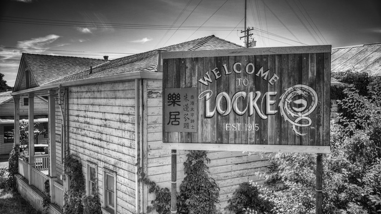 Black and white image of Locke, California's welcome sign