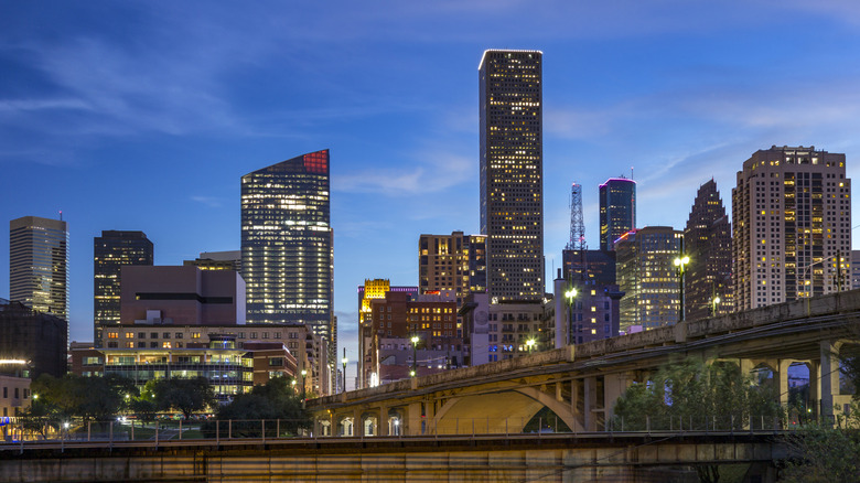 Buildings with lights on at night in downtown Houston