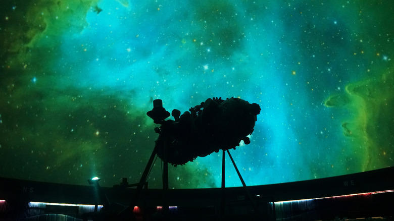 Green and blue star formations projected at a planetarium