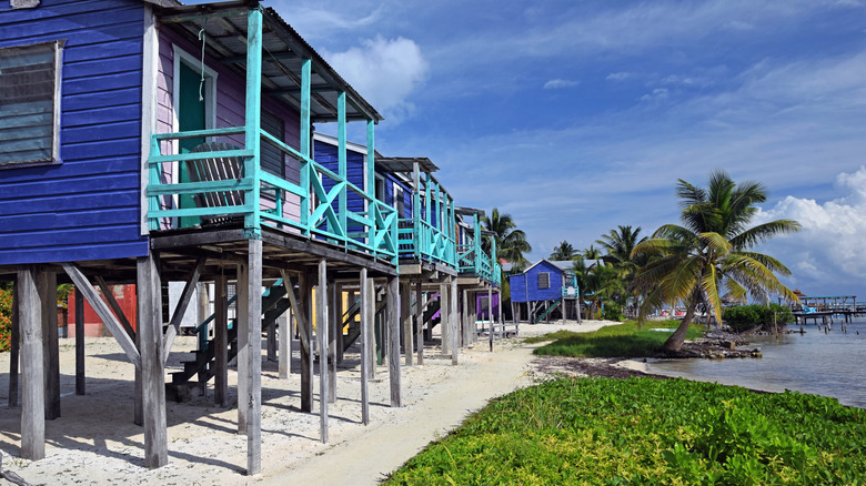 Colorful wooden houses on the sand in Caye Caulker, Belize