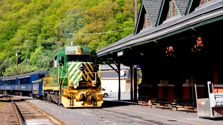 Lehigh Gorge Scenic Railway train passing through a stop in Pennsylvania