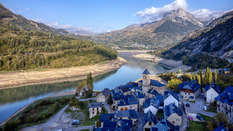 Traditional lakeside town of Lanuza with mountain background