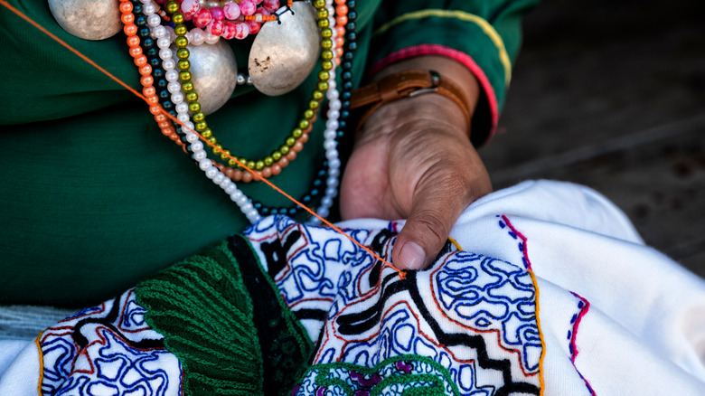 Shipibo-Konibo woman embroidering Amazonian art