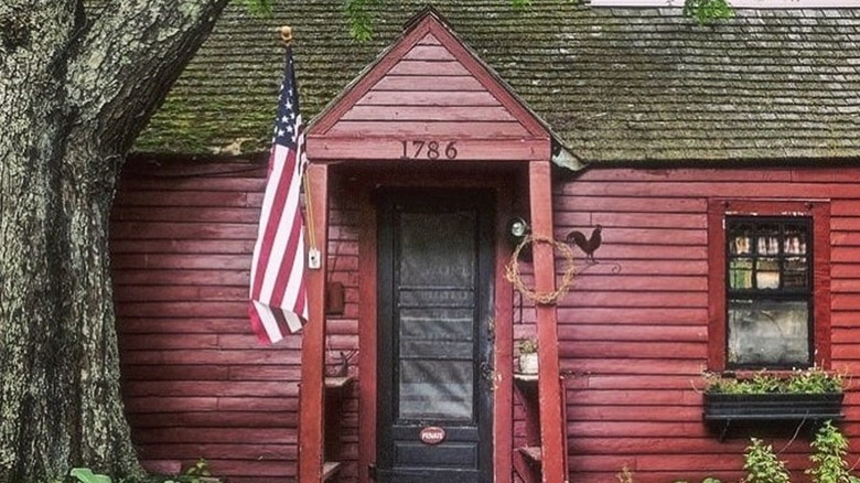 Approach the rustic facade of the restaurant