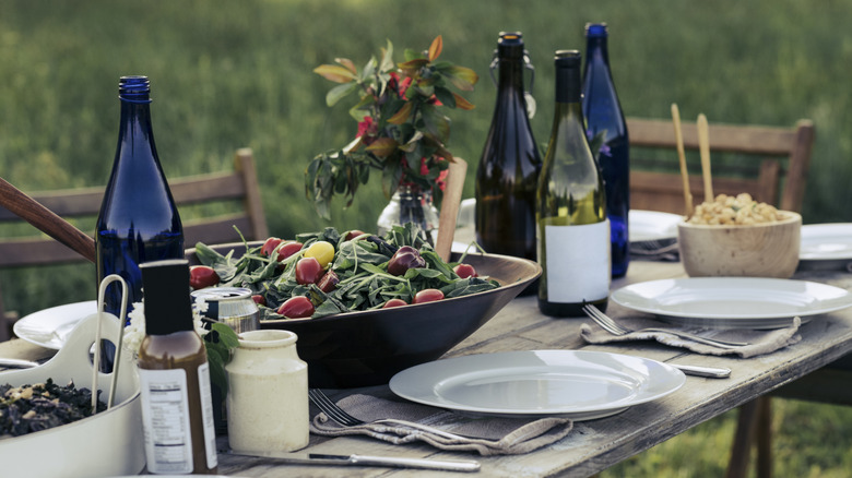 an elegant set dinner table with wine