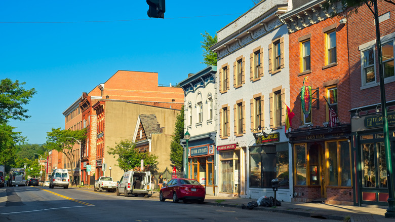 A rowhouse-lined street in downtown Peekskill, New York, on a sunny day