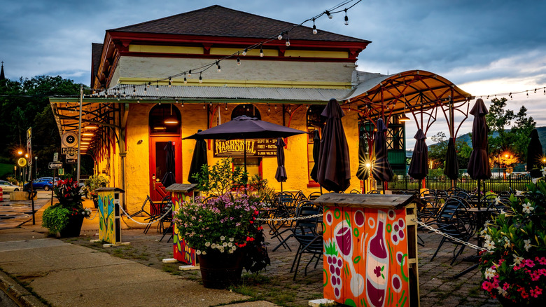 A café with outdoor seating in Peekskill, New York, during sundown