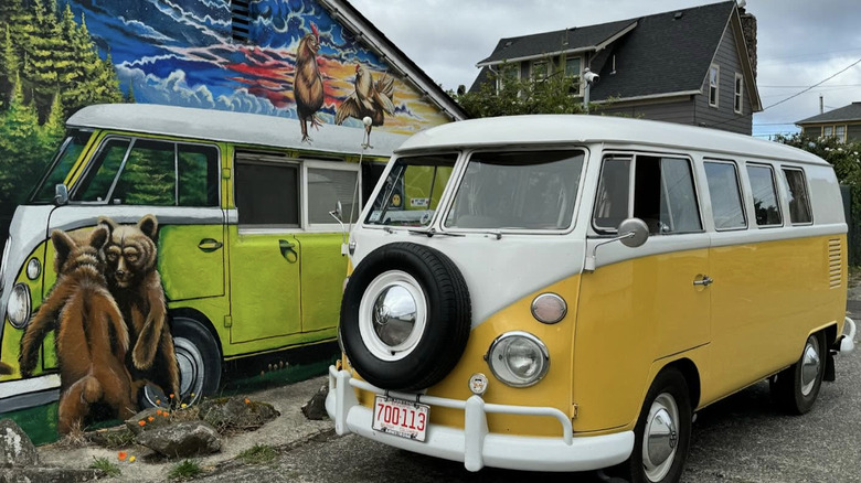 Exterior of Itty Bitty Inn motel with vintage van.