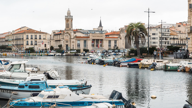 Canals lined with boats and historic buildings in Sete, France