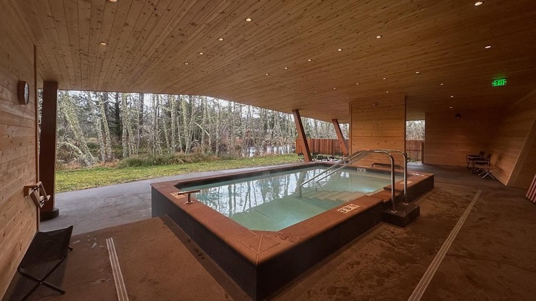 Interior of a wooden spa at Snow Peak Campfield