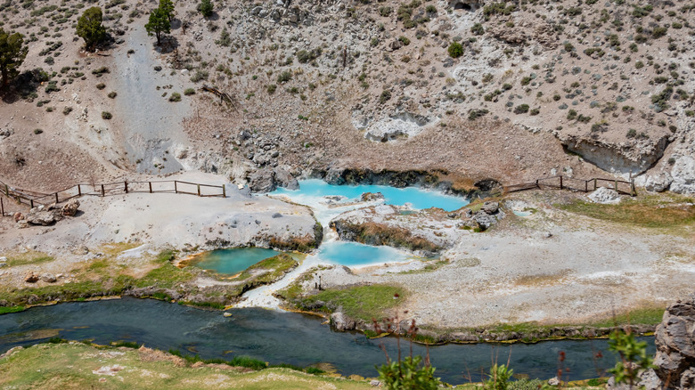 A view of turquoise pools in a geothermal spring