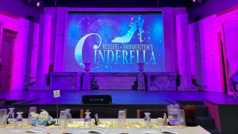 Set table in front of stage with "Cinderella" title projected