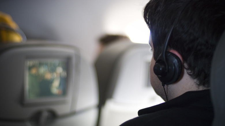 A plane passenger watching a film in-flight