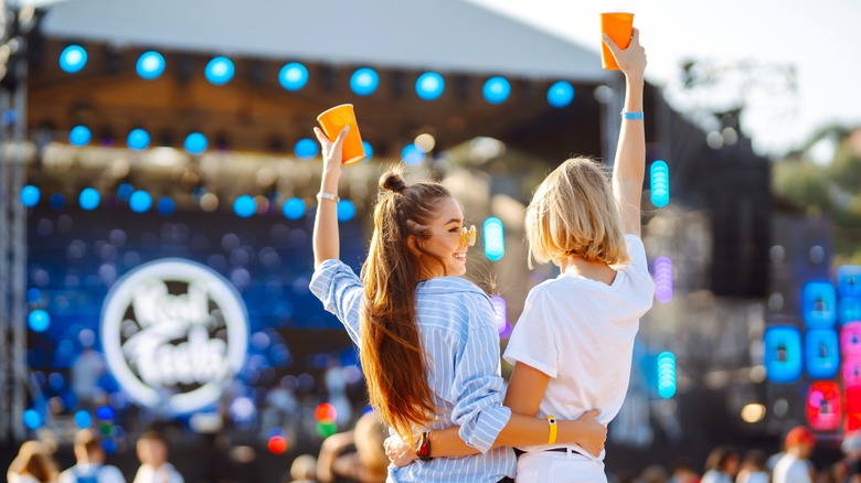 two people celebrate at music festival