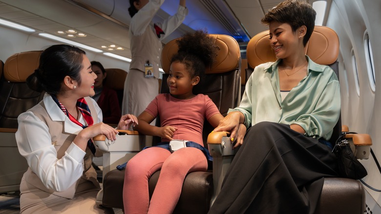 flight attendant with parent kid