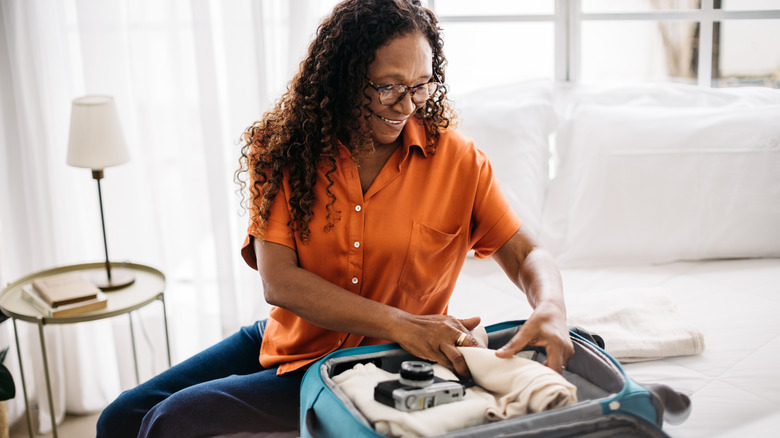 woman packing carry-on