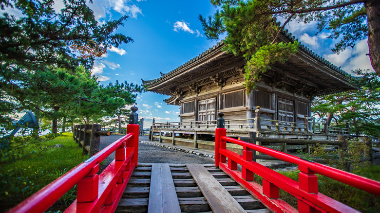 Godaido temple and the red lacquered bridge on a sunny day