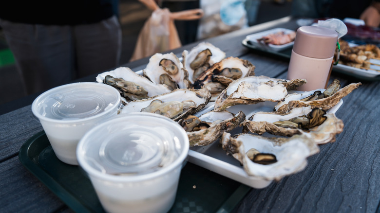 A tray of oysters on a table