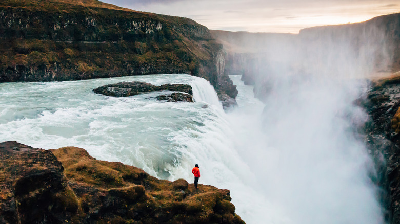 Person overlooking the Gulfoss waterfall in Iceland