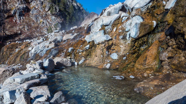 Idaho rocky hot spring pool with steam