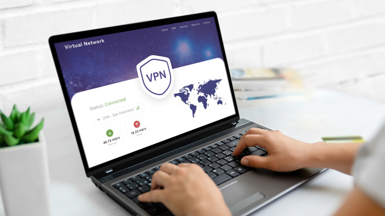 Person on computer open to a VPN site