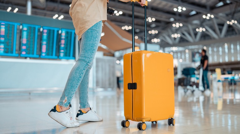 Traveler walking inside an airport