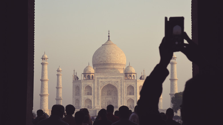 Visitor taking Taj Mahal photo
