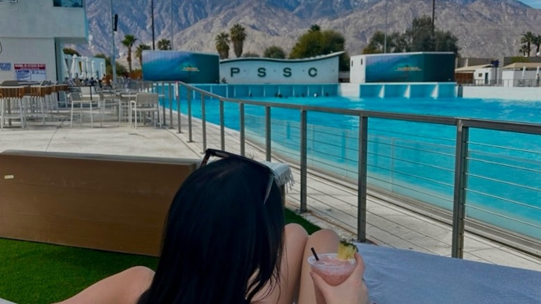 Girl drinking a cocktail at Palm Springs Surf Club