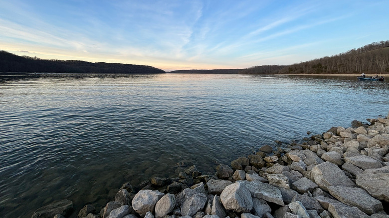 Brookville Lake at sunset with a view of a distant boat