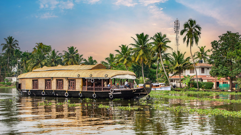 A houseboat on a lake in Alappuzha, India