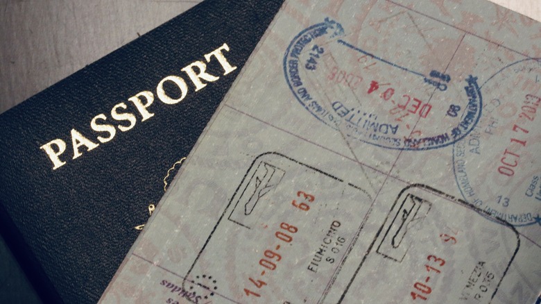 One closed passport and one open