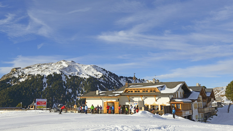 Skiiers at a hut on Seceda mountain in the Italian Dolomites