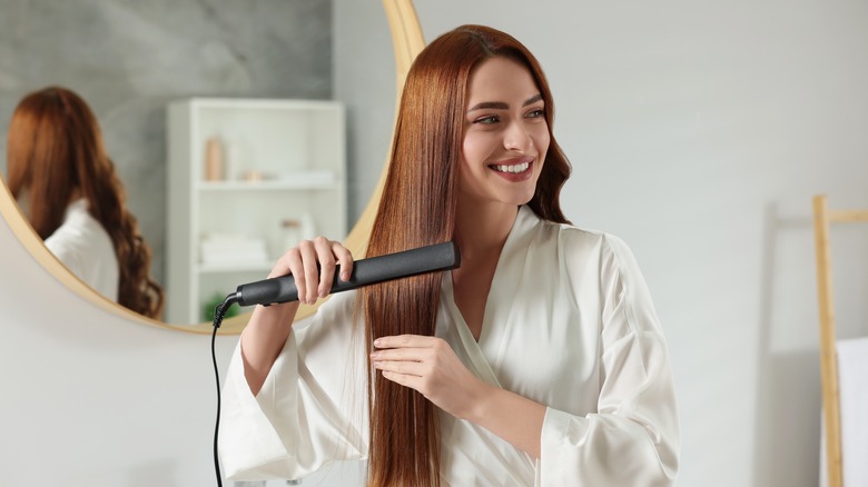 Woman using a hair iron