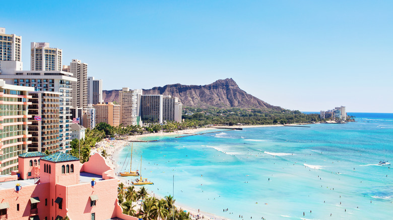 Beach in Hawaii mountain and tall buildings