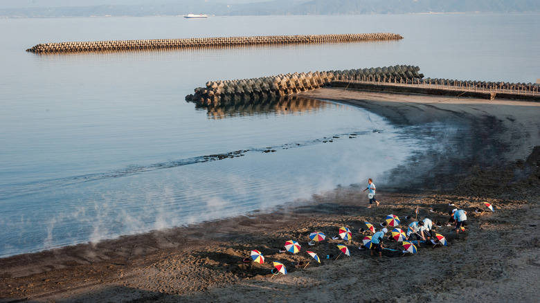 An aerial view of people enjoying the Japanese sand baths near Ibusuki