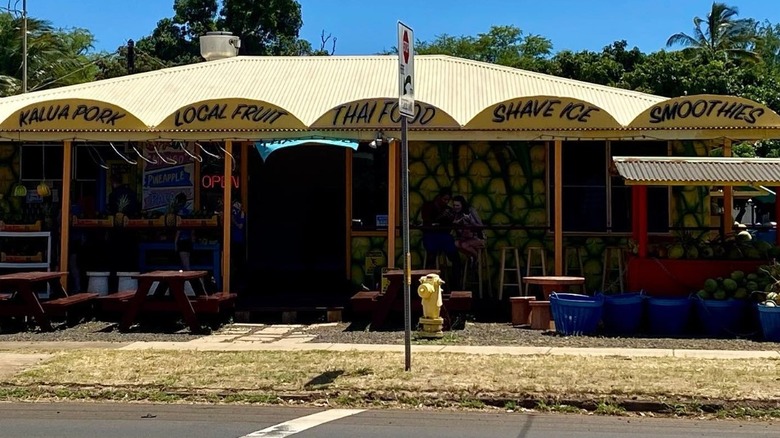 Coconut Corner's yellow awning and storefront