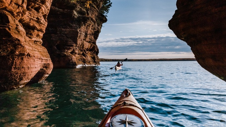 Kayaking through the arches and sea caves of the Apostle Islands shoreline