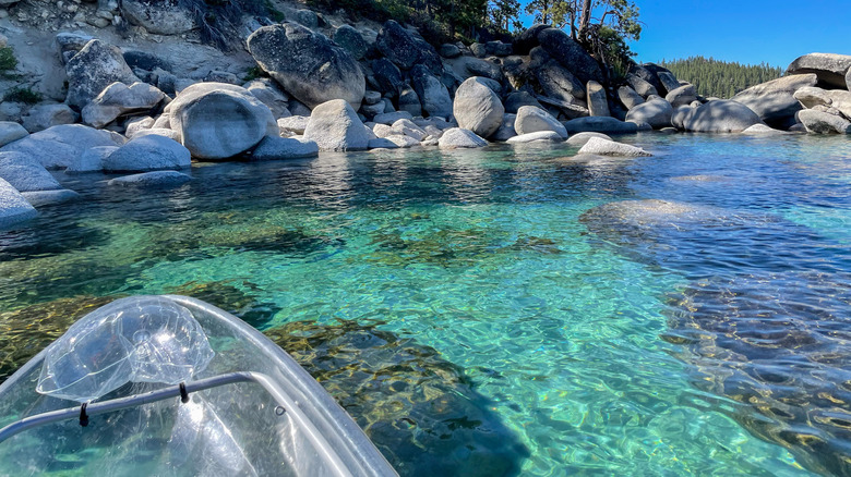 the front of clear kayak above the clear waters of Sand Harbor