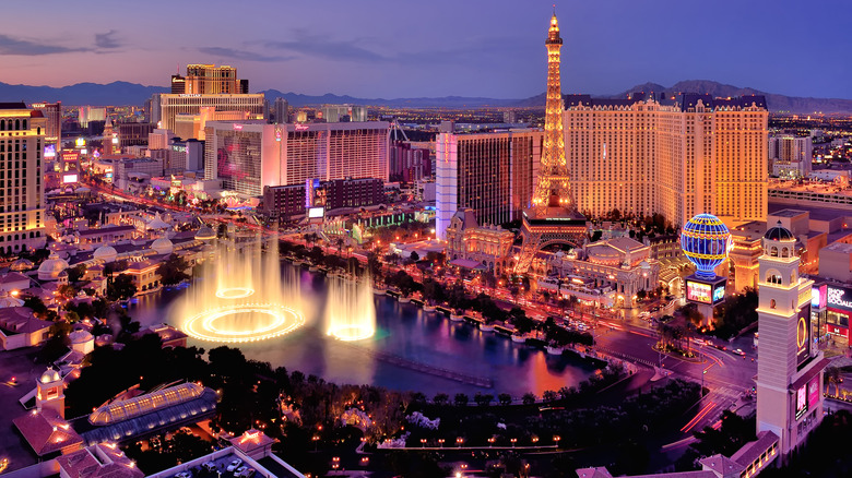 An aerial view of Las Vegas during a sunset with most of the lights on full display