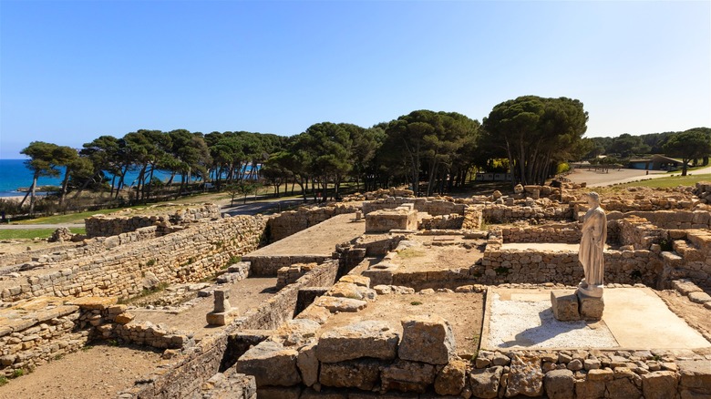 Ancient Greco-Roman ruins by the sea.