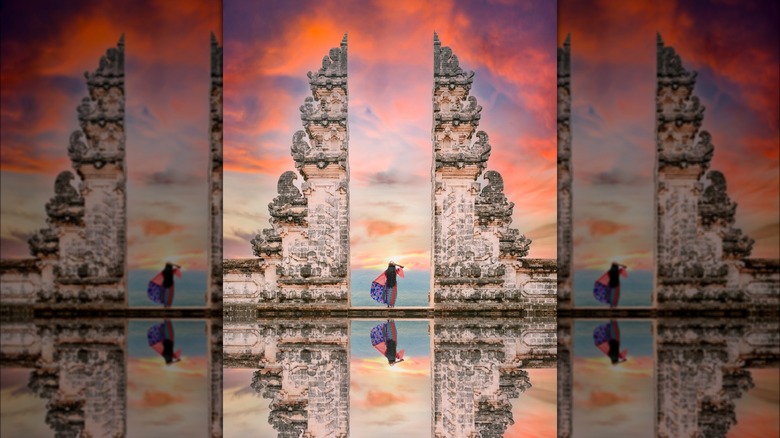 Woman posing at the Gates of Heaven in Bali